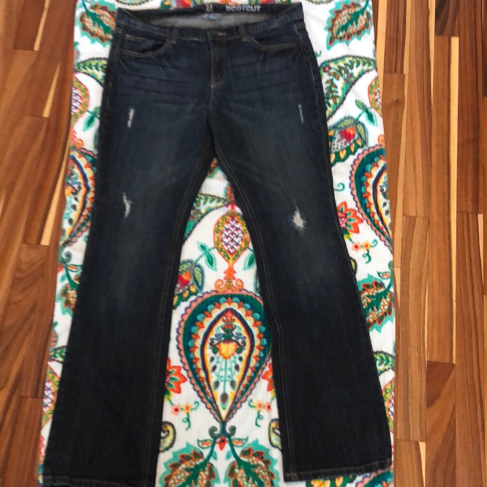 Distressed low rise bootcut blue jeans